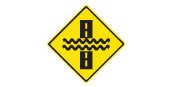Ontario road sign: There may be water flowing over the road