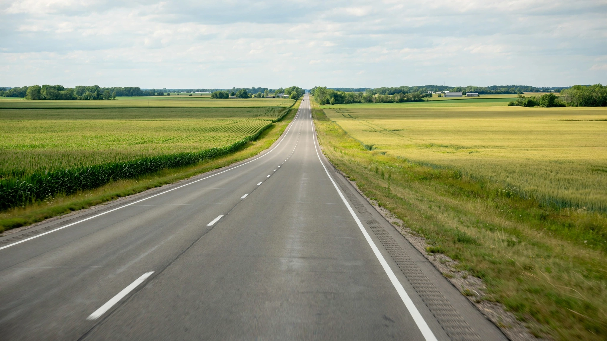 Long straight Ontario highway through fields — Ontario G1 practice
