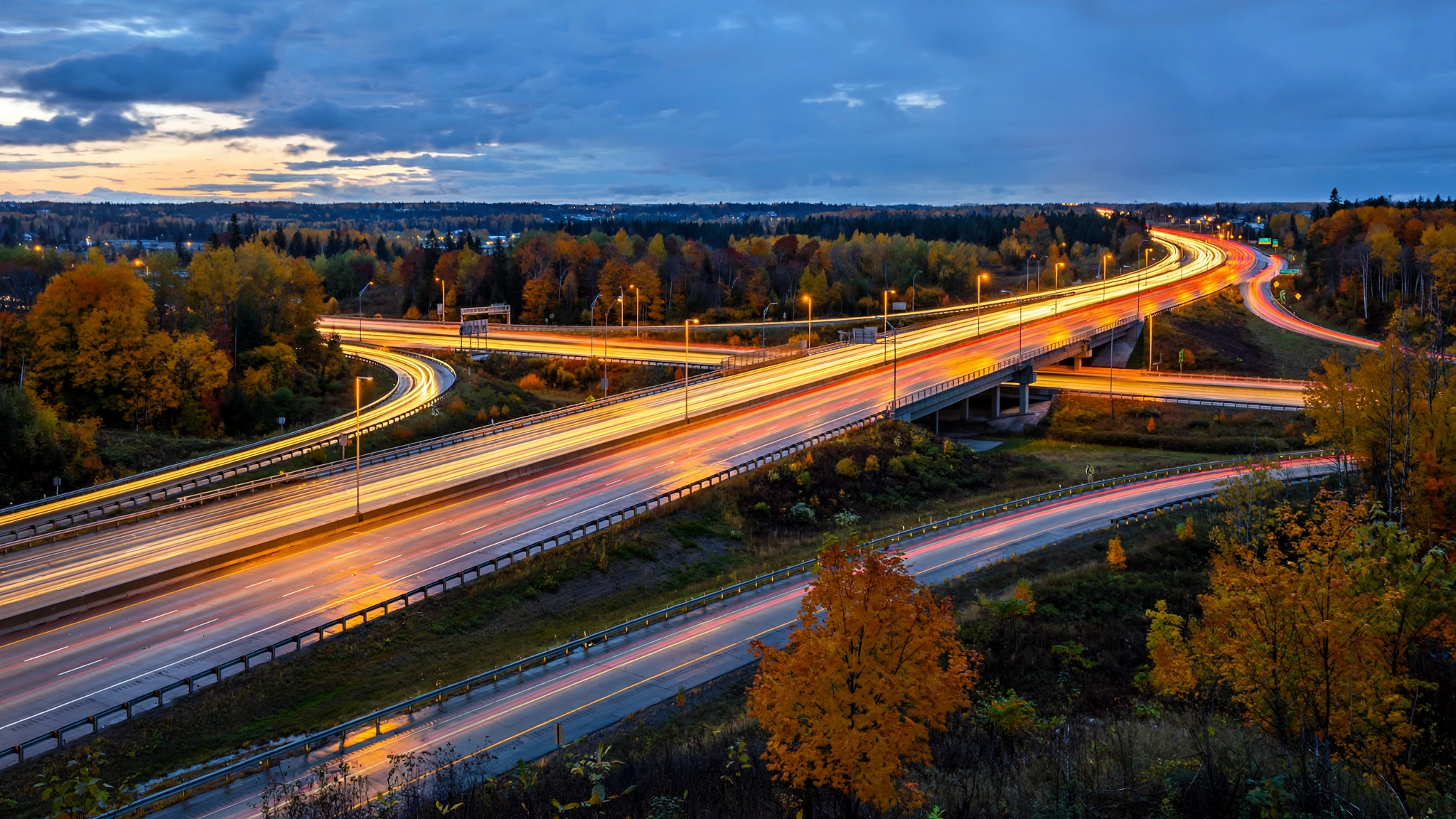 Highway interchange at dusk with car light trails — Ontario G1 practice